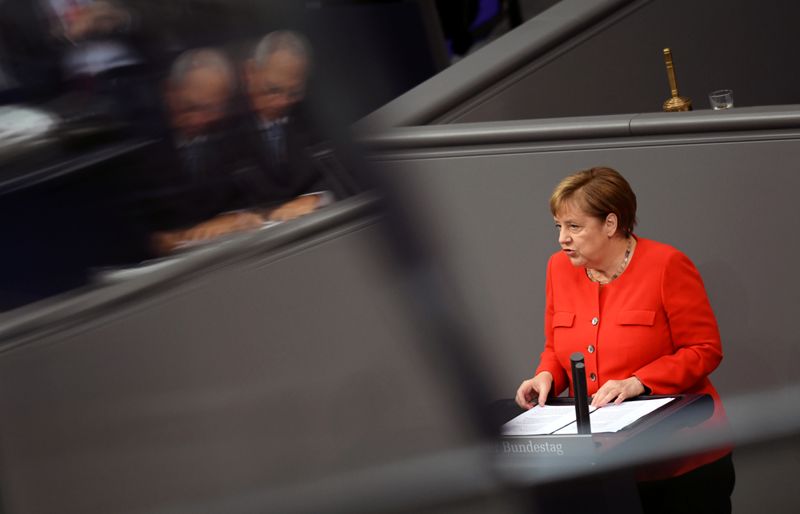 &copy; Reuters. FILE PHOTO: German Chancellor Angela Merkel addresses the lower house of parliament Bundestag, in Berlin