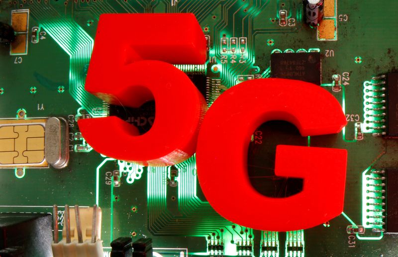 &copy; Reuters. FILE PHOTO: 3D-printed objects representing 5G are put on a motherboard in this picture illustration