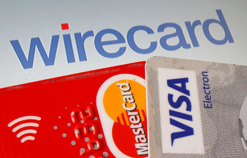 © Reuters. Mastercard and Visa credit cards are seen in front of displayed Wirecard logo in this illustration picture
