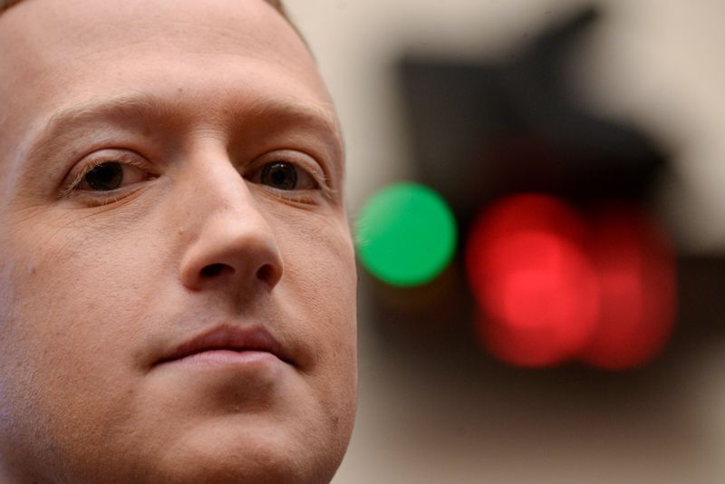 © Reuters. FILE PHOTO: Facebook Chairman and CEO Zuckerberg testifies at a House Financial Services Committee hearing in Washington