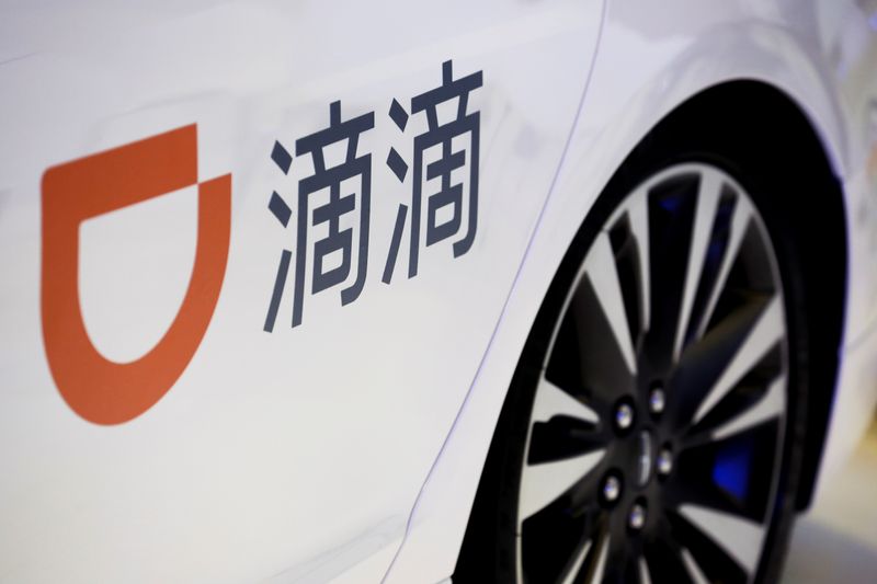 &copy; Reuters. FILE PHOTO: The company logo of the Didi ride-hailing app on a car door at the IEEV New Energy Vehicles Exhibition in Beijing