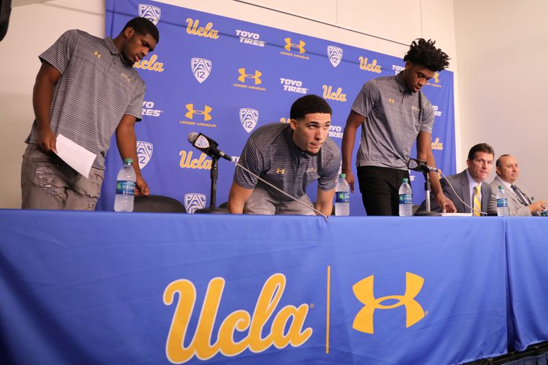 © Reuters. UCLA basketball players Cody Riley, LiAngelo Ball, and Jalen Hill arrive to speak at a press conference at UCLA after flying back from China where they were detained on suspicion of shoplifting, in Los Angeles