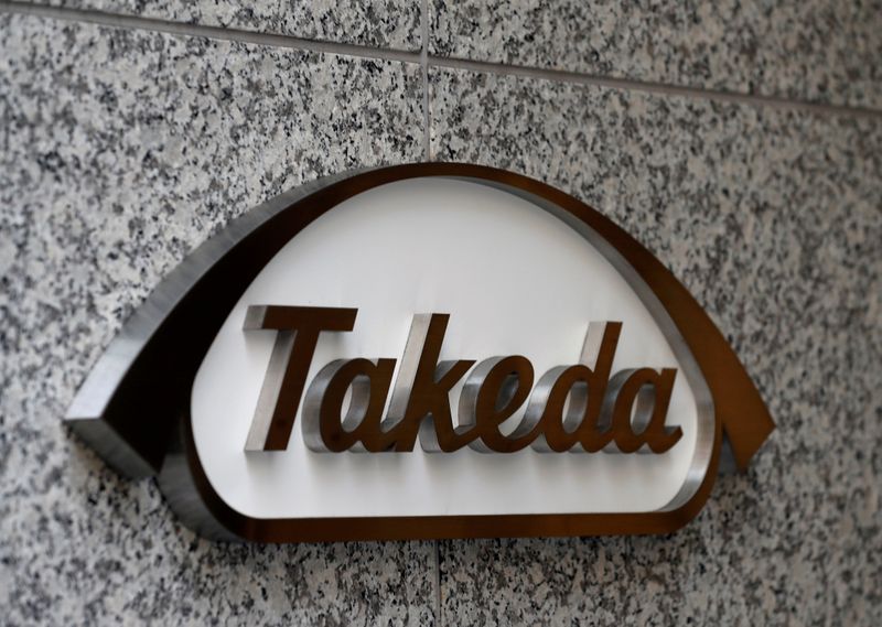 &copy; Reuters. FILE PHOTO: Takeda Pharmaceutical Co&apos;s logo is seen at its new headquarters in Tokyo