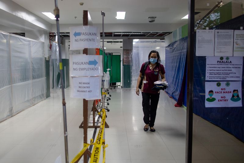 © Reuters. Between duty and family: Philippines doctor isolates at home after work