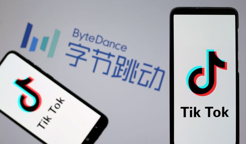 &copy; Reuters. FILE PHOTO: TikTok logos are seen on smartphones in front of displayed ByteDance logo in this illustration