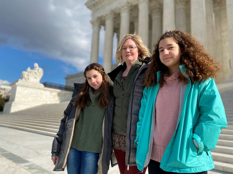 © Reuters. FILE PHOTO: Montana resident Kendra Espinoza, a key plaintiff in a major religious rights case to be argued before the U.S. Supreme Court, poses in front of the building in Washington