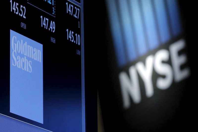 &copy; Reuters. A screen displays the ticker symbol and information for Goldman Sachs on the floor of the New York Stock Exchange