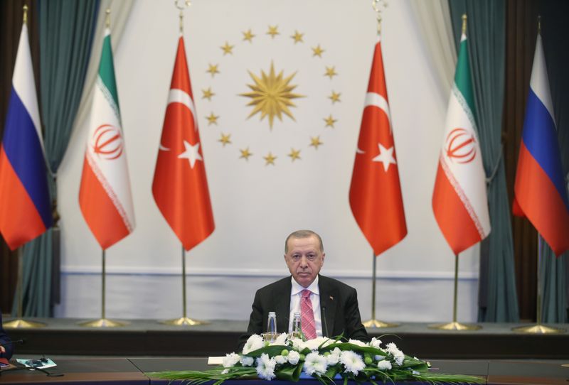&copy; Reuters. Turkish President Erdogan attends a video conference call with Russia&apos;s President Putin and Iran&apos;s President Rouhani in Ankara