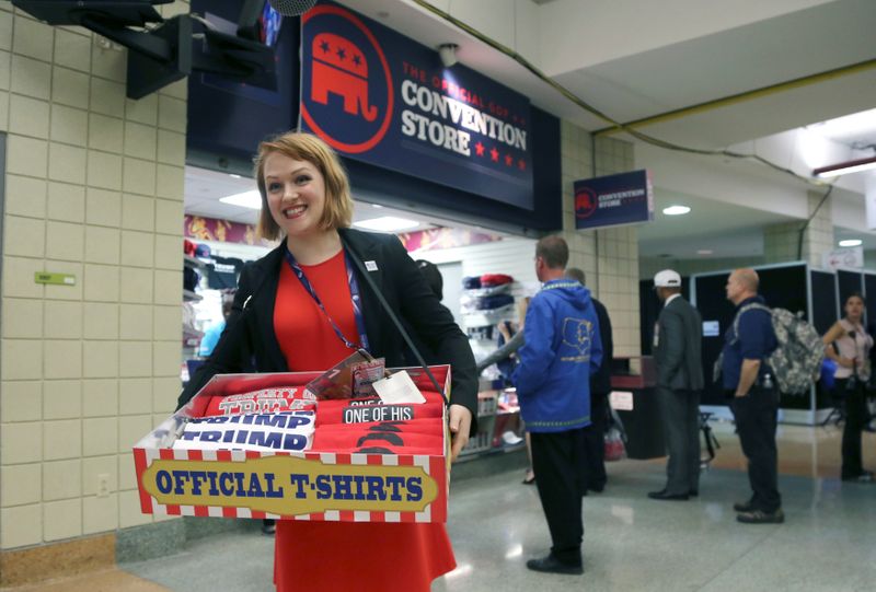 &copy; Reuters. FILE PHOTO: A vendor shows off Donald Trump t-shirts for sale at one of the RNC Convention Stores inside the arena selling goods to delegates