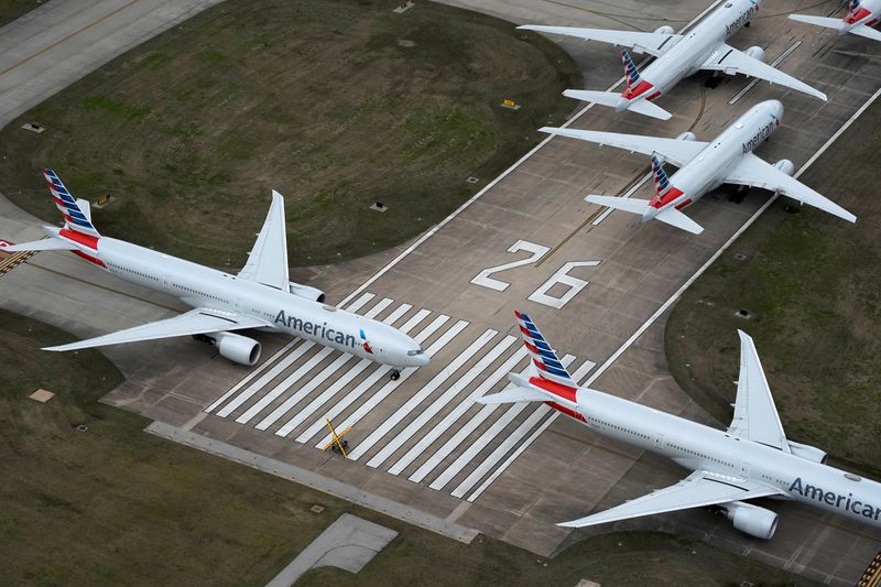 &copy; Reuters. FILE PHOTO: American Airlines passenger planes crowd a runway in Tulsa