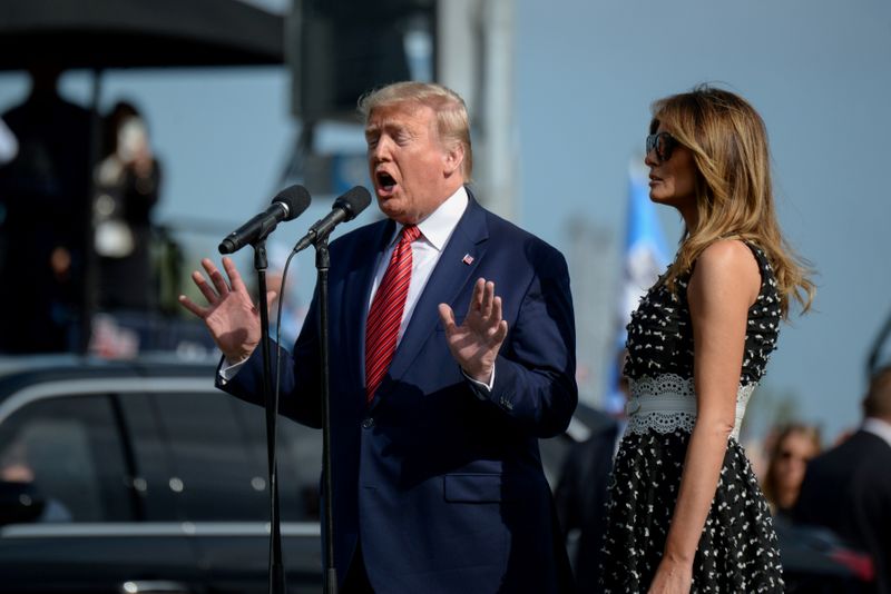 © Reuters. FILE PHOTO: U.S. President Donald Trump, as Grand Marshal, gives the 