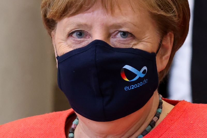 &copy; Reuters. German Chancellor Angela Merkel wearing a face mask is seen after a session at the upper house of the German parliament Bundesrat, following the outbreak of the coronavirus disease (COVID-19), in Berlin