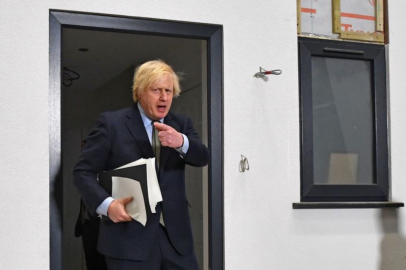 &copy; Reuters. FILE PHOTO: Britain&apos;s Prime Minister Boris Johnson Britain&apos;s gestures after inspecting a modular house, after delivering a speech during his visit to Dudley College of Technology in Dudley