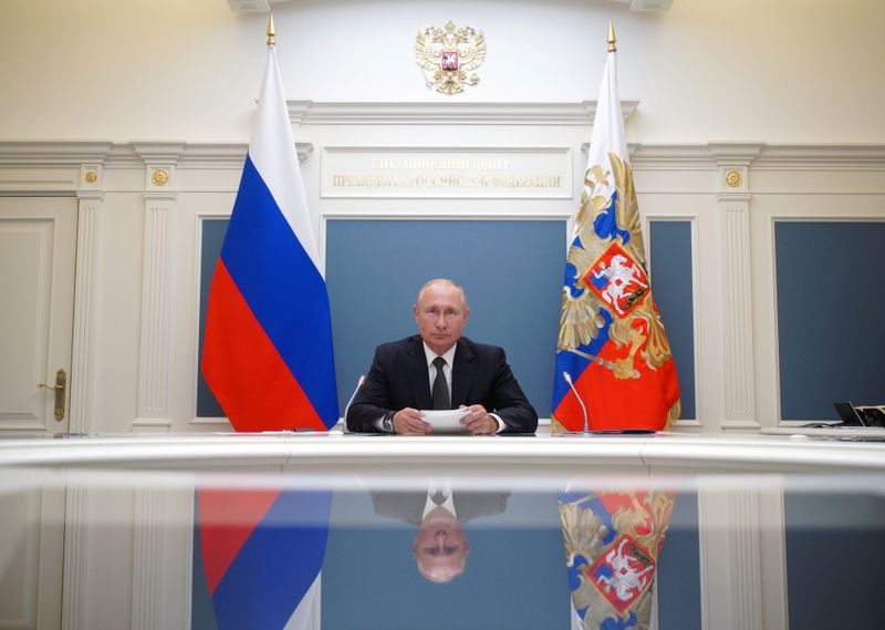 &copy; Reuters. FILE PHOTO: Russian President Putin takes part in a video conference call in Moscow