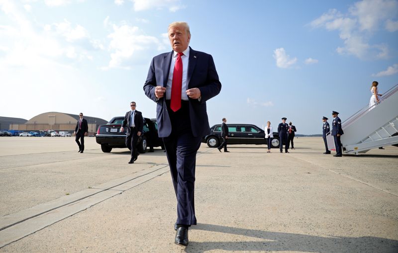 &copy; Reuters. U.S. President Donald Trump walks towards reporters before boarding Air Force One for travel to Mount Rushmore from Washington