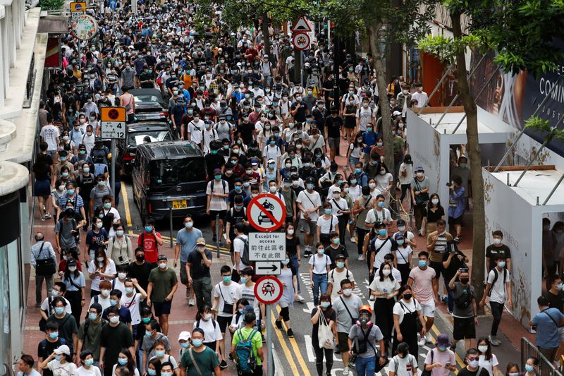 &copy; Reuters. Anti-national security law protesters march at the anniversary of Hong Kong&apos;s handover to China from Britain, in Hong Kong