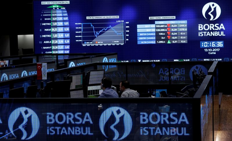 &copy; Reuters. FILE PHOTO: Traders work at their desks on the floor of the Borsa Istanbul in Istanbul