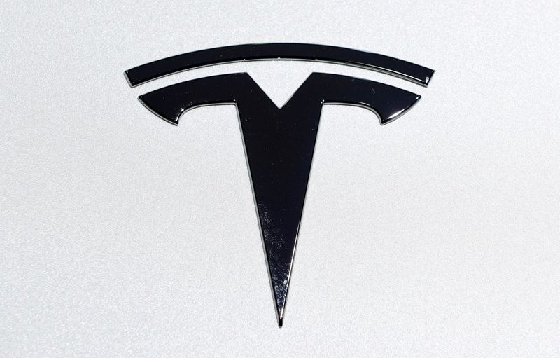 &copy; Reuters. FILE PHOTO: The Tesla logo is pictured on an electric car at Brussels Motor Show