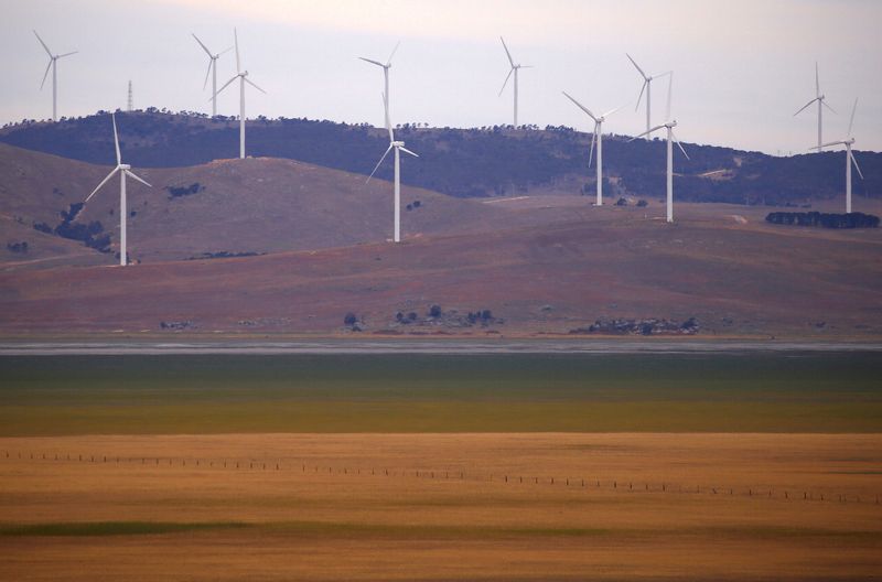 &copy; Reuters. FILE PHOTO: A fence is seen in front of wind turbines that are part of the Infigen Energy Capital Wind Farm located on the hills surrounding Lake George, near the Australian capital city of Canberra