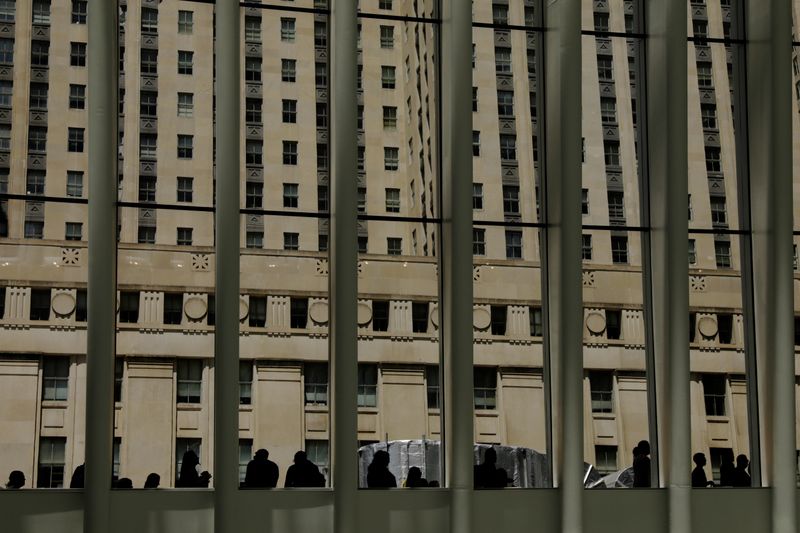 &copy; Reuters. Pedestrians sit around the outside of the Oculus transportation hub in New York