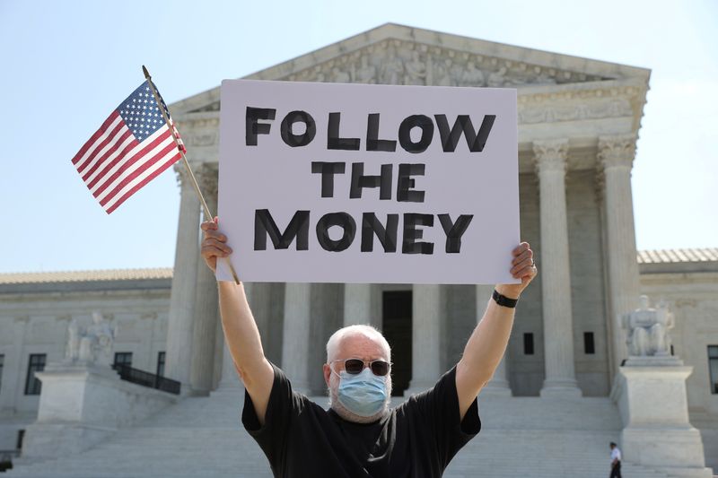 © Reuters. Demonstrator holds sign outside the U.S. Supreme Court in Washington