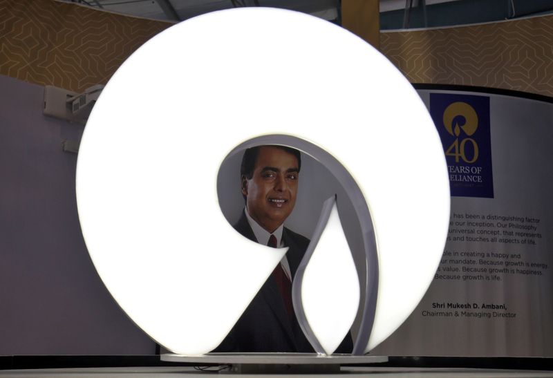 © Reuters. FILE PHOTO: The logo of Reliance Industries is pictured in a stall at the Vibrant Gujarat Global Trade Show at Gandhinagar
