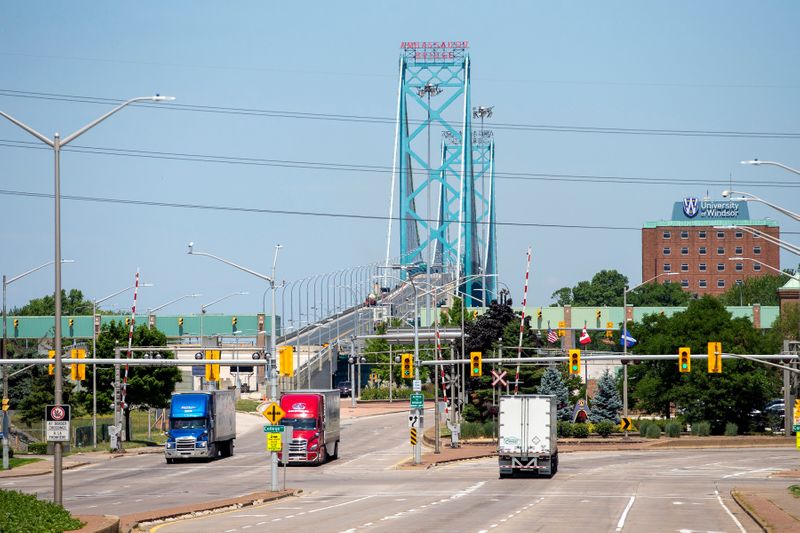 &copy; Reuters. FILE PHOTO: Trucks traverse the Ambassador Bridge in Windsor