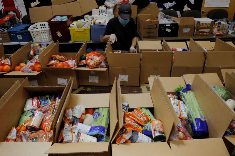 &copy; Reuters. Workers prepare free food for distribution at the Chelsea Collaborative in Chelsea