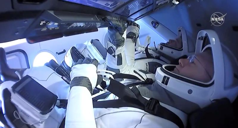 &copy; Reuters. NASA astronauts Robert Behnken and Douglas Hurley are seen aboard SpaceX&apos;s Dragon Endeavour spacecraft