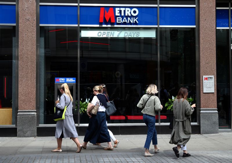 &copy; Reuters. FILE PHOTO: People walk past a Metro Bank in London