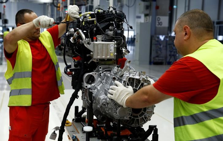 &copy; Reuters. Workers work on a new Volkswagen Crafter diesel engine EA 288 at the newly opened Volkswagen factory in Wrzesnia near Poznan