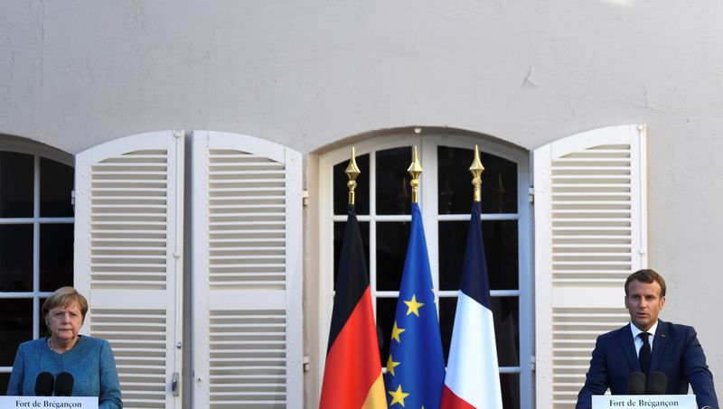 &copy; Reuters. French President Emmanuel Macron and German Chancellor Angela Merkel meet at Fort de Bregancon