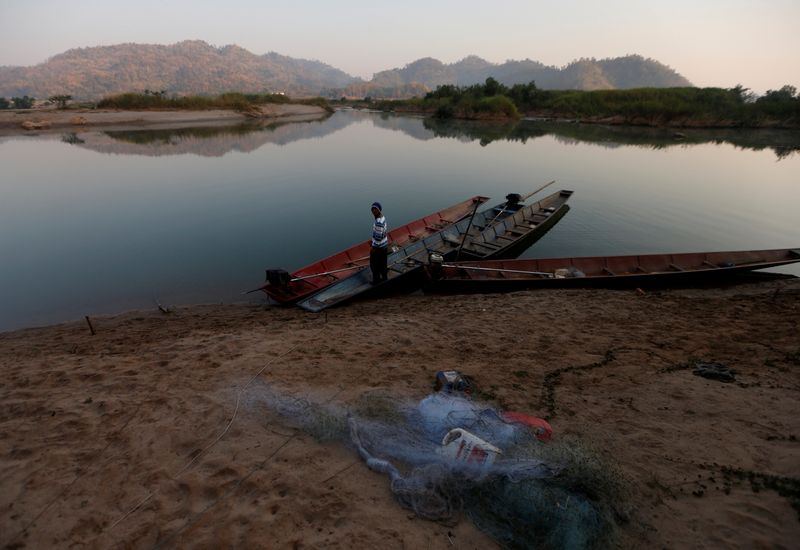 &copy; Reuters. FILE PHOTO: A fisherman is seen on the  Mekong river bank outside Nong Khai