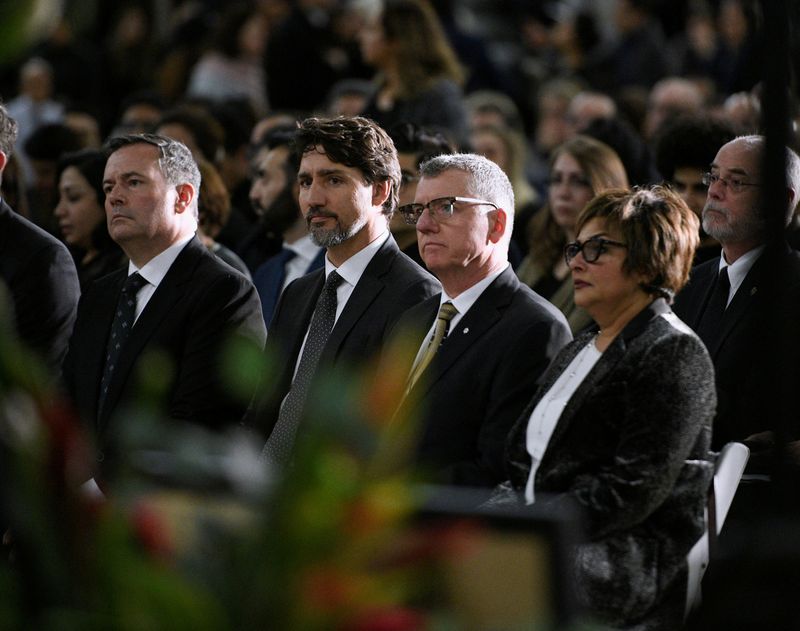 &copy; Reuters. FILE PHOTO: Mourners attend a service in memory of the victims of a Ukrainian passenger plane that crashed in Iran