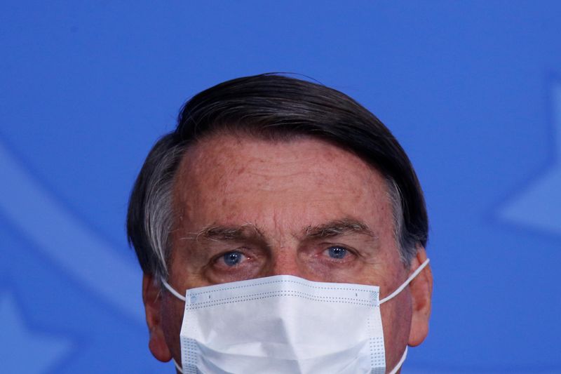 &copy; Reuters. Brazil&apos;s President Jair Bolsonaro looks on during a ceremony to launch a program to expand access to credit at the Planalto Palace in Brasilia