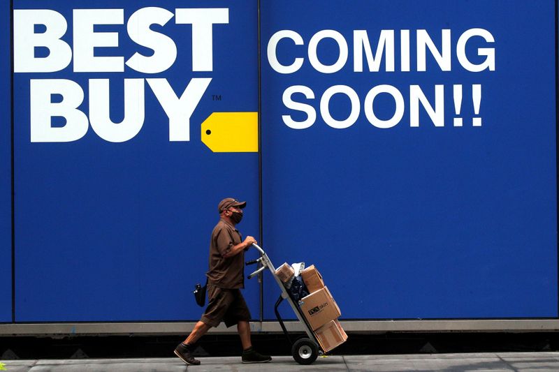 &copy; Reuters. FILE PHOTO: A delivery person passes by a sign for a new Best Buy store in New York