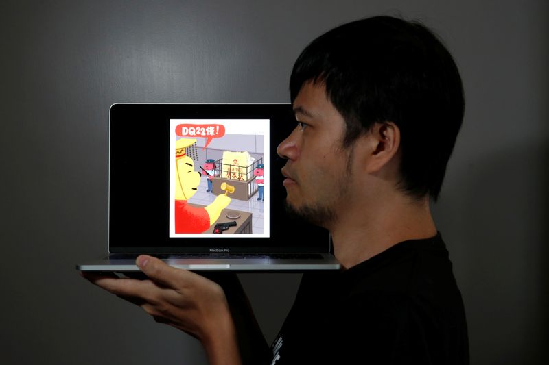 &copy; Reuters. Political illustrator Ah To poses with his cartoon after his column in one of the city&apos;s popular news magazines will get axed in Hong Kong