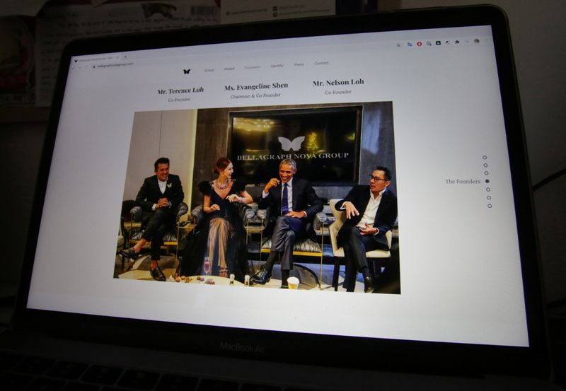 &copy; Reuters. A photo on the website of Bellagraph Nova Group showing owners sitting next to former U.S. president Barack Obama is pictured in Singapore