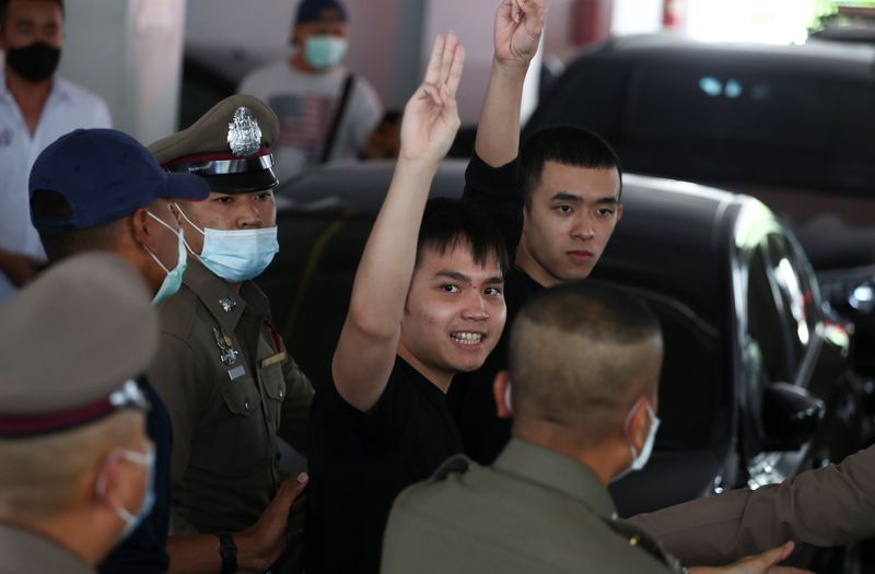 &copy; Reuters. Pro-democracy leaders Tattep Ruangprapaikitseree and Panumas Singprom arrested in Bangkok