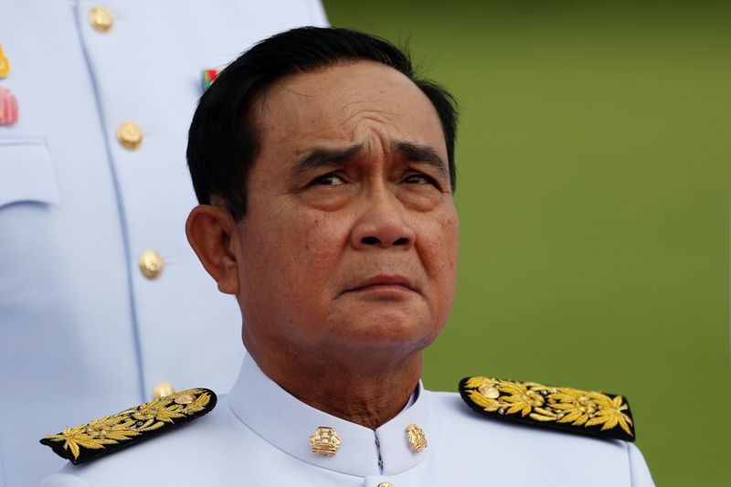 © Reuters. Thailand's Prime Minister Prayuth Chan-ocha attends a family photo session with new cabinet ministers at the Government House in Bangkok