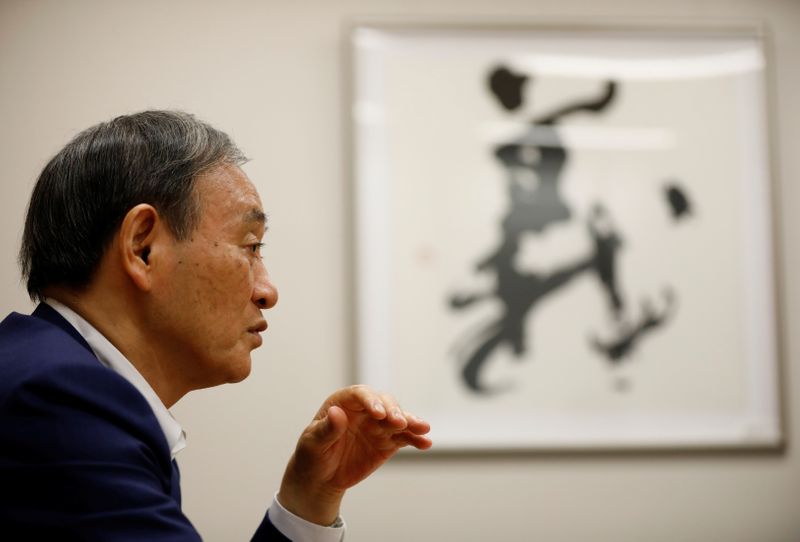 &copy; Reuters. NEJapan&apos;s top government spokesman Chief Cabinet Secretary Yoshihide Suga speaks during an interview with Reuters in Tokyo