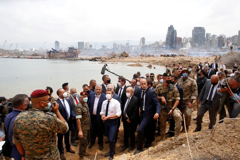 &copy; Reuters. French President Emmanuel Macron visits the devastated site of the explosion at the port of Beirut