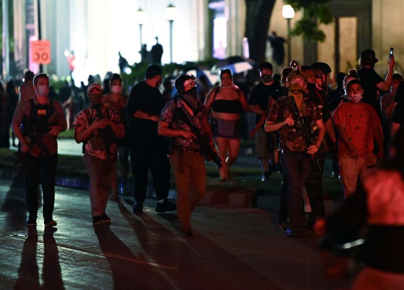 &copy; Reuters. People protest after a Black man identified as Jacob Blake was shot several times by police in Kenosha