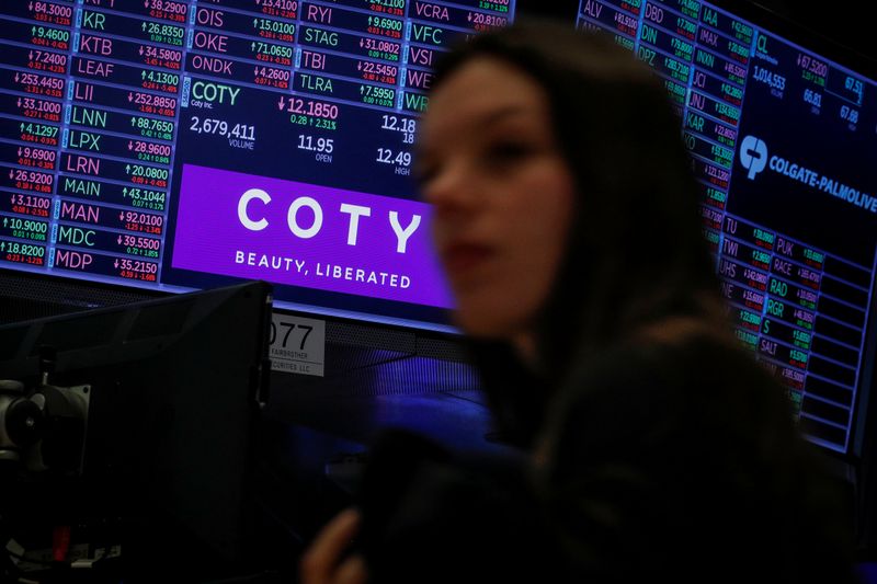 &copy; Reuters. A screen displays the logo and trading information for Coty Inc at the NYSE in New York