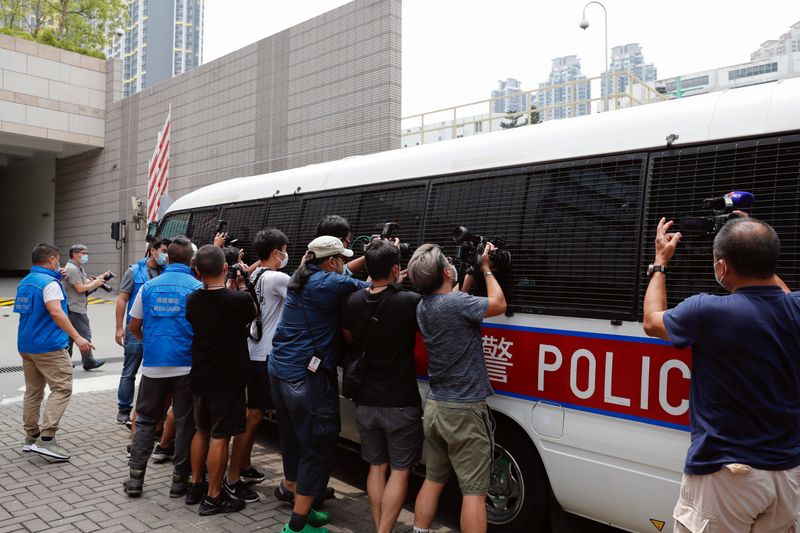 &copy; Reuters. Journalists take photos and videos of a police van which is believed to carry Democratic Party lawmaker Lam Cheuk-ting, in Hong Kong