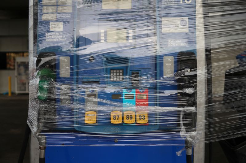 © Reuters. FILE PHOTO: A fuel pump is wrapped closed with plastic ahead of the arrival of Hurricane Laura in Beaumont, Texas