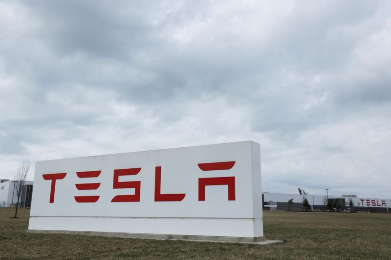 Tesla shares surge to record high, leaving rivals behind