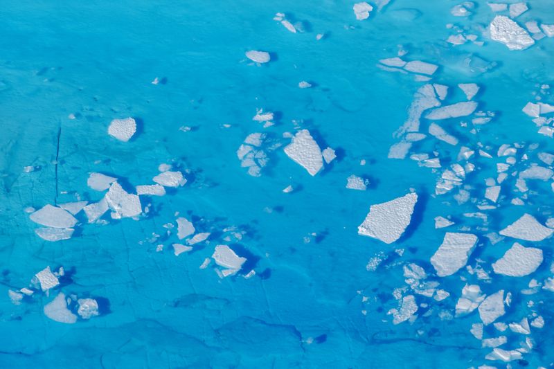 &copy; Reuters. FILE PHOTO: FILE PHOTO: Chunks of ice float inside of meltwater pools on top of the Helheim glacier near Tasiilaq, Greenland