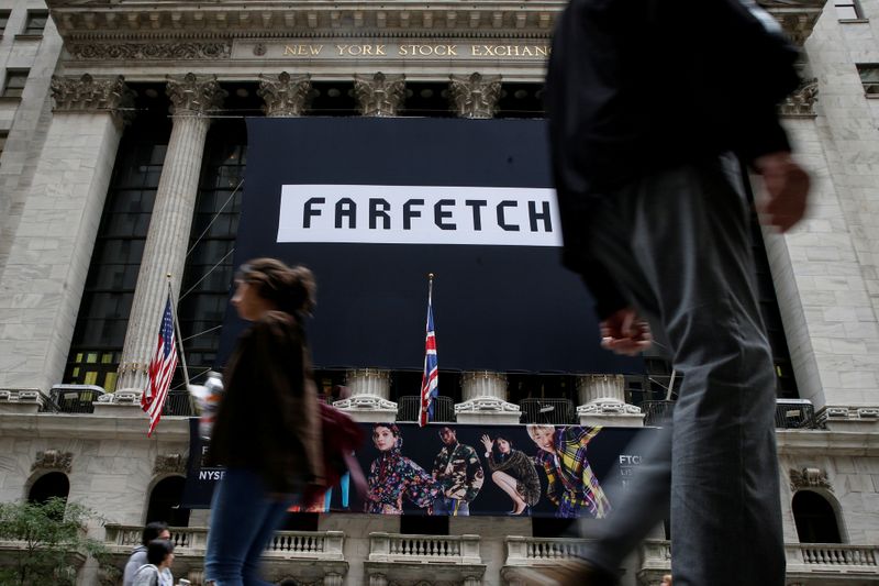 &copy; Reuters. FILE PHOTO: A banner to celebrate the IPO of online fashion house Farfetch is displayed on the facade of the of the NYSE in New York