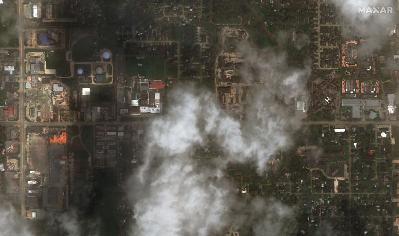 © Reuters. Satellite imagery showing damaged buildings along W McNeese Street after Hurricane Laura hit Lake Charles, Louisiana, U.S. in this August 27, 2020 handout photo